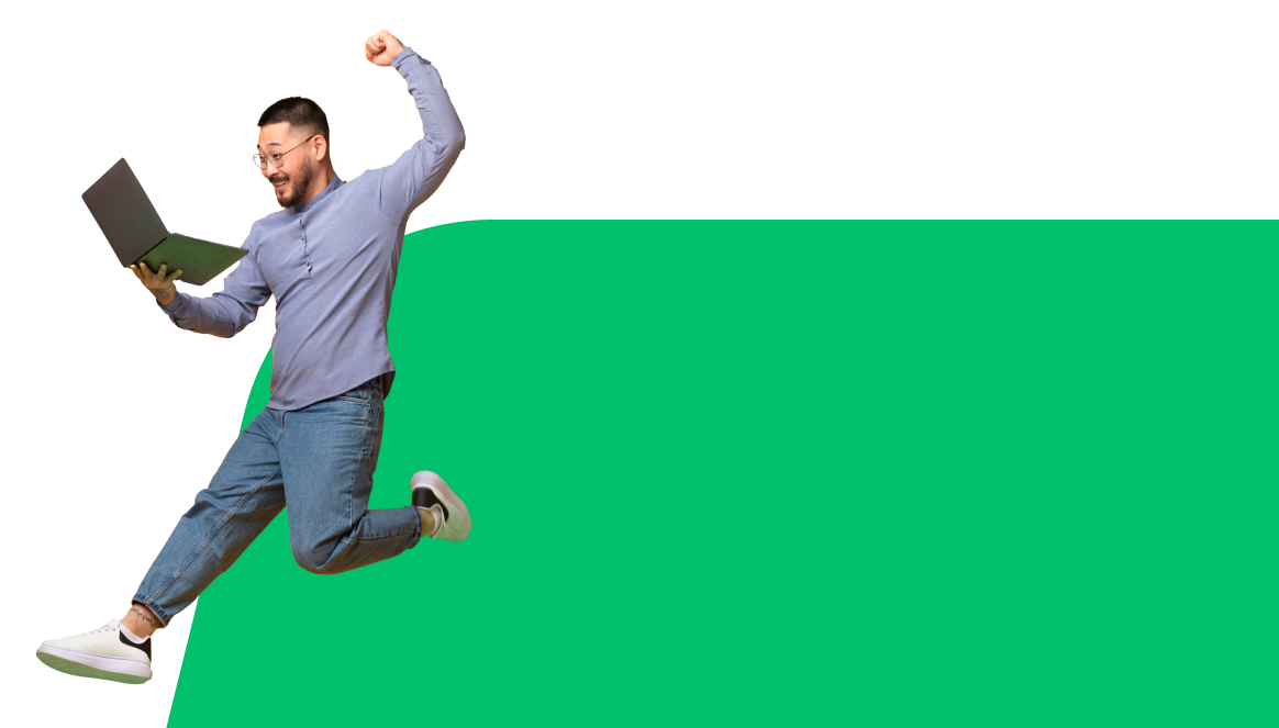 a man jumping with a laptop computer