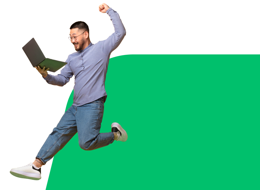 a man jumping with a laptop in his hand