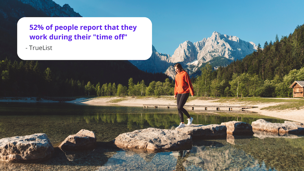 A wooman walking across rocks during a vacation in the mountains. 52% of people work during their time off according to TrueList