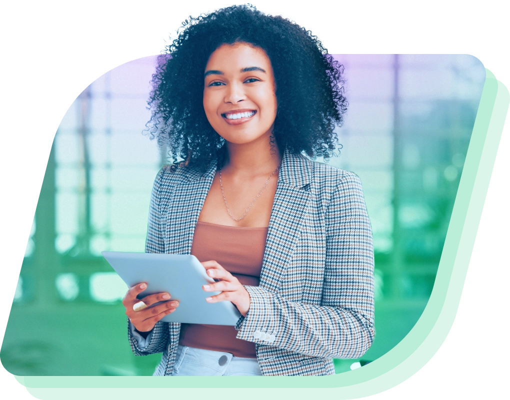 a woman holding a tablet and smiling