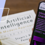 an hr professional using a cell phone to access chatgpt while reading a book about artificial intelligence