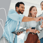 a group of people standing around a tablet