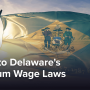 The Delaware state flag flying in the wind during the early morning sunlight.