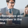 A man dressed in business attire proudly showing a trophy to a dejected coworker.