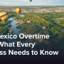 Hot air balloons flying over the Rio Grande river in New Mexico.