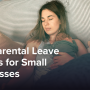 A woman laying in bed holding a newborn baby.