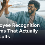 Happy coworkers high-fiving in an office.