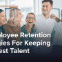 A group of coworkers laughing and smiling.