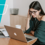 An HR manager wearing earbuds taking a break to listen to a podcast on her laptop