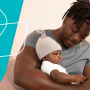 a man reading a book to his baby