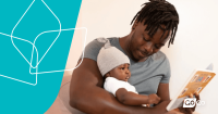 a man reading a book to his baby