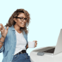 a woman standing in front of a laptop